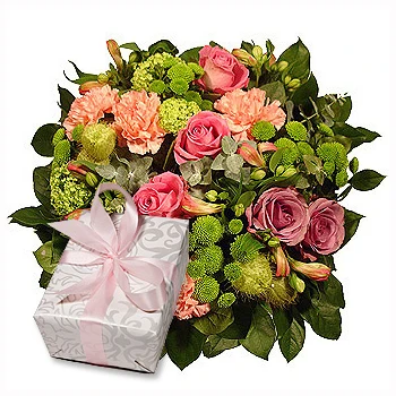 A spectacular bouquet of pink roses, peach carnations, mums and daisies accompanied by a delicately wrapped box with a pink ribbon of delicious bonbons to share and cherish tender moment with someone special. It's an ideal love-giving gift for him and her.